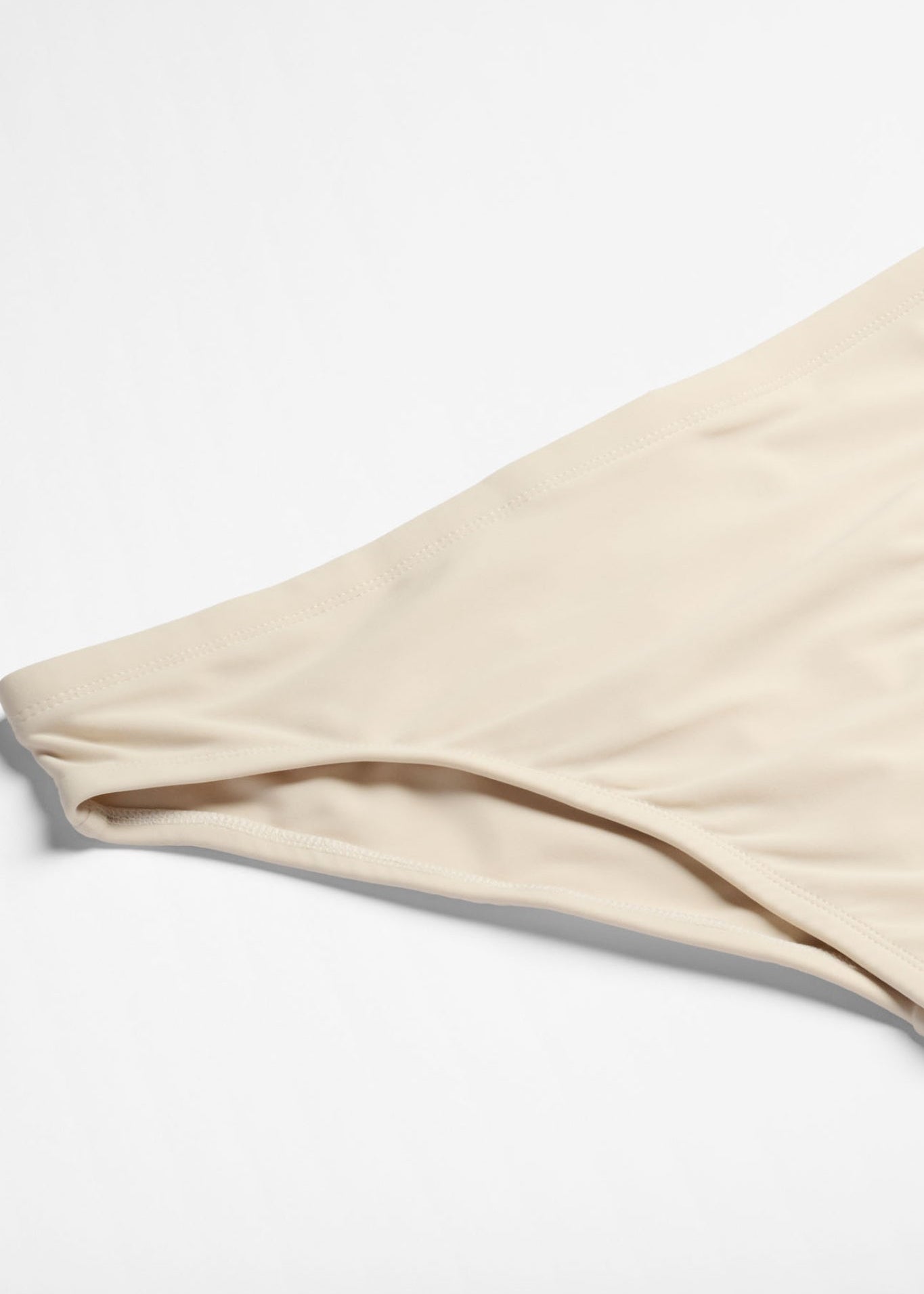 White swim briefs on a white background