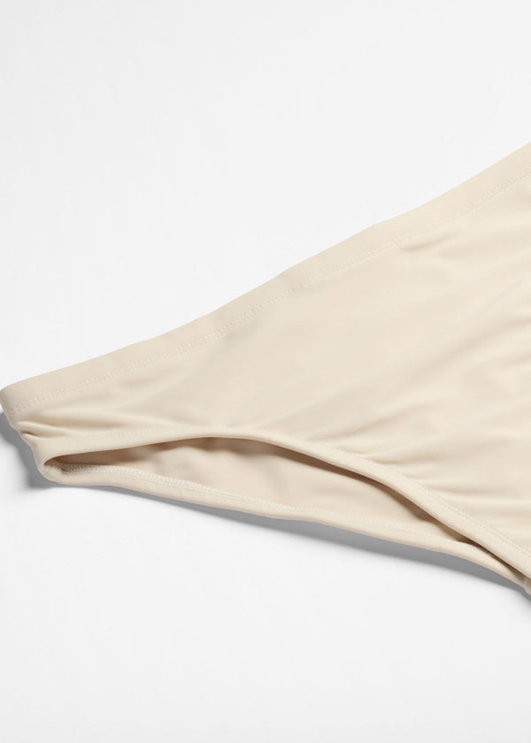 White swim briefs on a white background